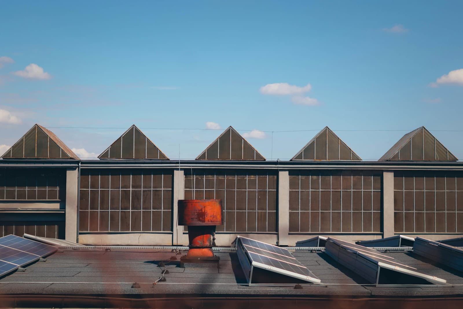 Solar panels on the sawtooth roof of an industrial building